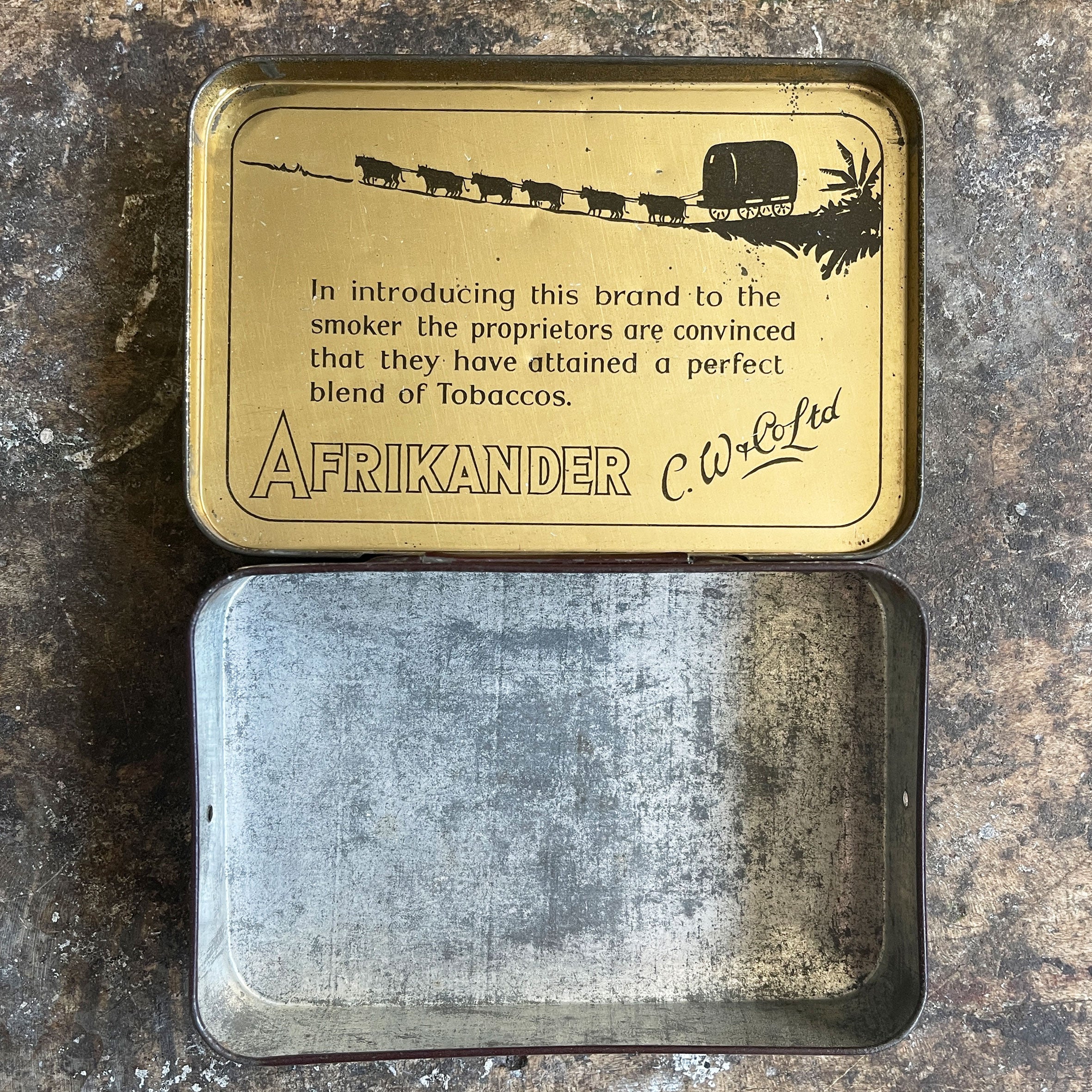 A large vintage Afrikander Smoking Mixture Tin from the 1930s with great colours and graphics to the front and inside hinged lid. Great, fresh condition - SHOP NOW - www.intovintage.co.uk