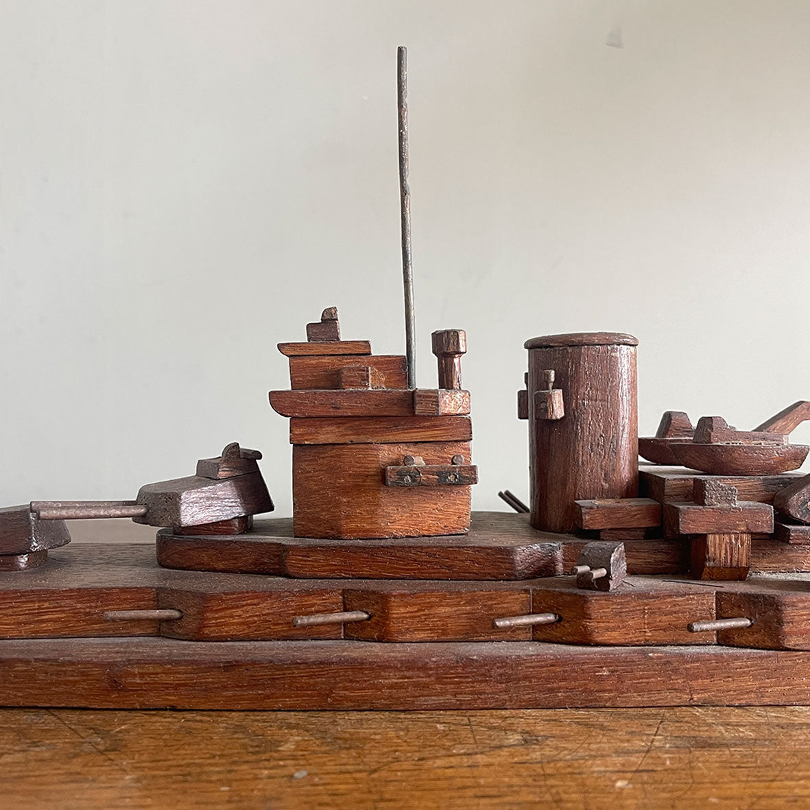 An 1940's vintage oak scratch-built battleship. Superbly built with perfect proportions, masts and fantastic rotating gun turrets. It has a flat bottom, so easy to display - SHOP NOW - Iintovintage.co.uk