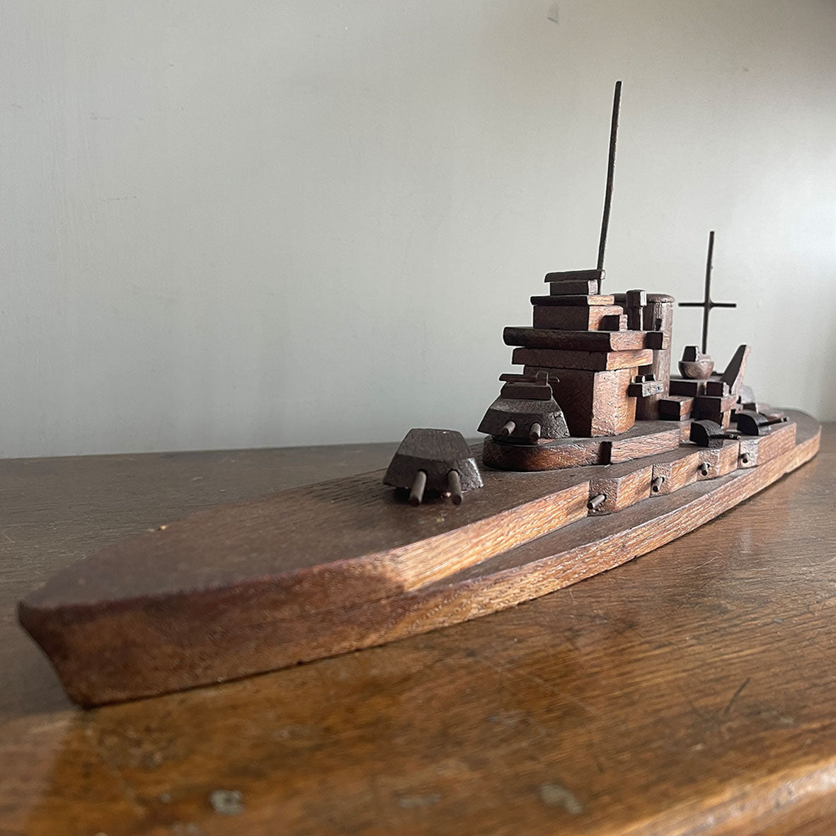 An 1940's vintage oak scratch-built battleship. Superbly built with perfect proportions, masts and fantastic rotating gun turrets. It has a flat bottom, so easy to display - SHOP NOW - Iintovintage.co.uk