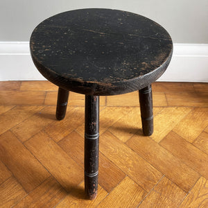 An Antique Pine Milking Stool with a wonderful original black painted finish that has worn away over its years of use to provide the great finish. Very solid and sitting on three turned legs - SHOP NOW - www.intovintage.co.uk