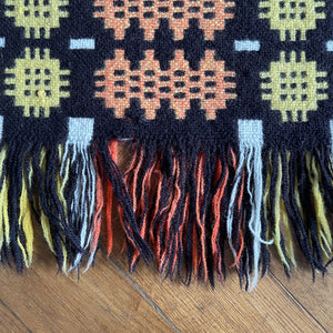 A pure wool Welsh Tapestry blanket in Black, Orange, Red, White and Yellow - SHOP NOW - www.intovintage.co.uk