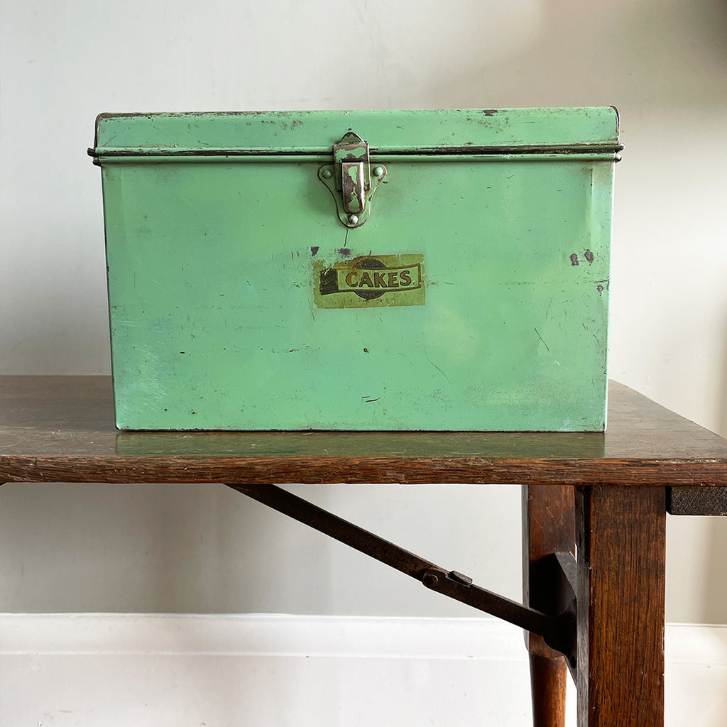 A Vintage Garrison Cake Tin in a fab duck egg green, and still having its 'CAKES' water slide sticker to the front. Open up the latch and find an inner tray that lifts out to reveal a larger space beneath - SHOP NOW - www.intovintage.co.uk