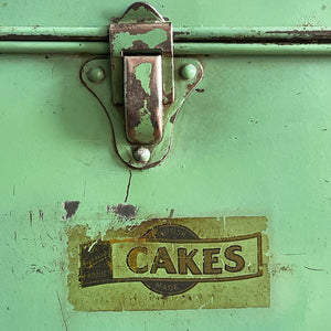 A Vintage Garrison Cake Tin in a fab duck egg green, and still having its 'CAKES' water slide sticker to the front. Open up the latch and find an inner tray that lifts out to reveal a larger space beneath - SHOP NOW - www.intovintage.co.uk