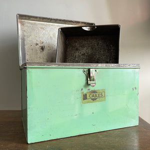 A Vintage Garrison Cake Tin in a fab duck egg green, and still having its 'CAKES' water slide sticker to the front. Open up the latch and find an inner tray that lifts out to reveal a larger space beneath - SHOP NOW - www.intovintage.co.uk