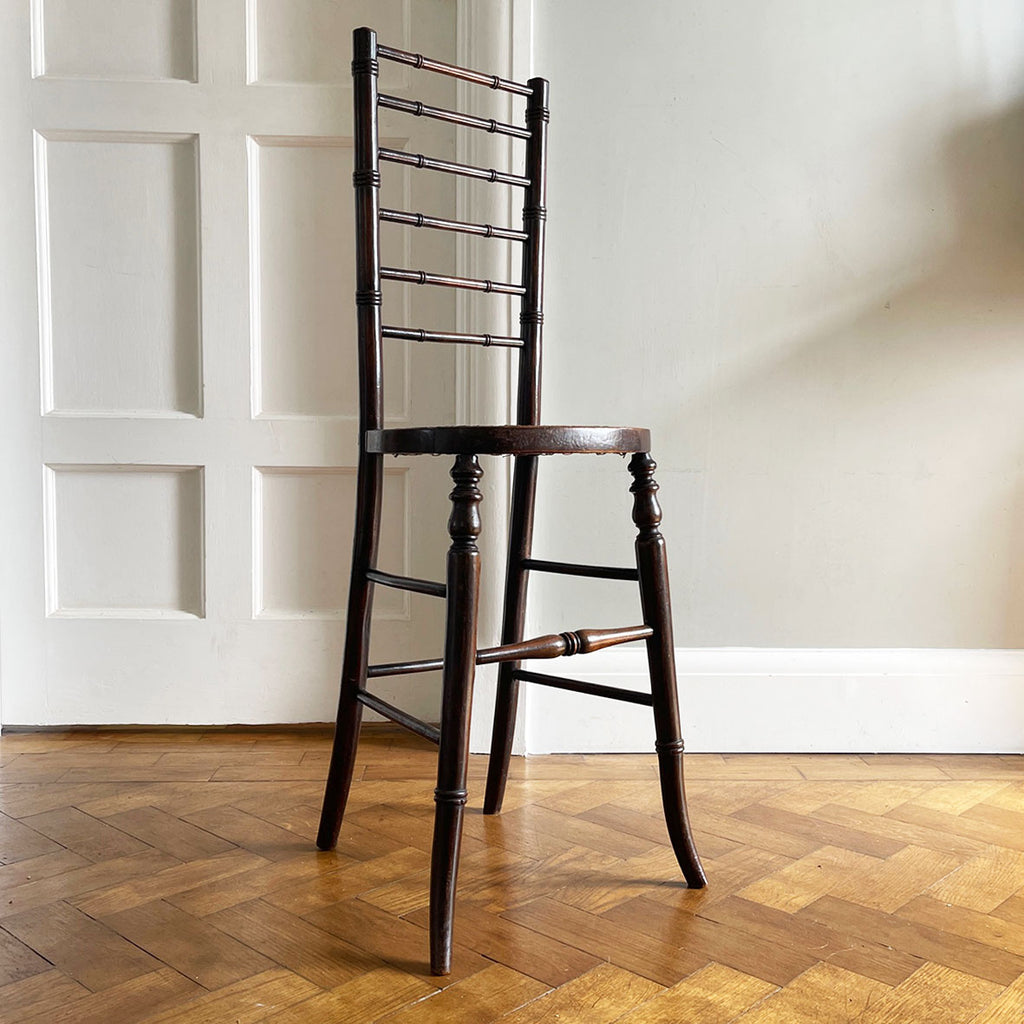 An exceptional example of an 19th Century deportment or correction chair. A beautifully turned ladder back, caned seat with turned and splayed legs. - SHOP NOW - www.intovintage.co.uk