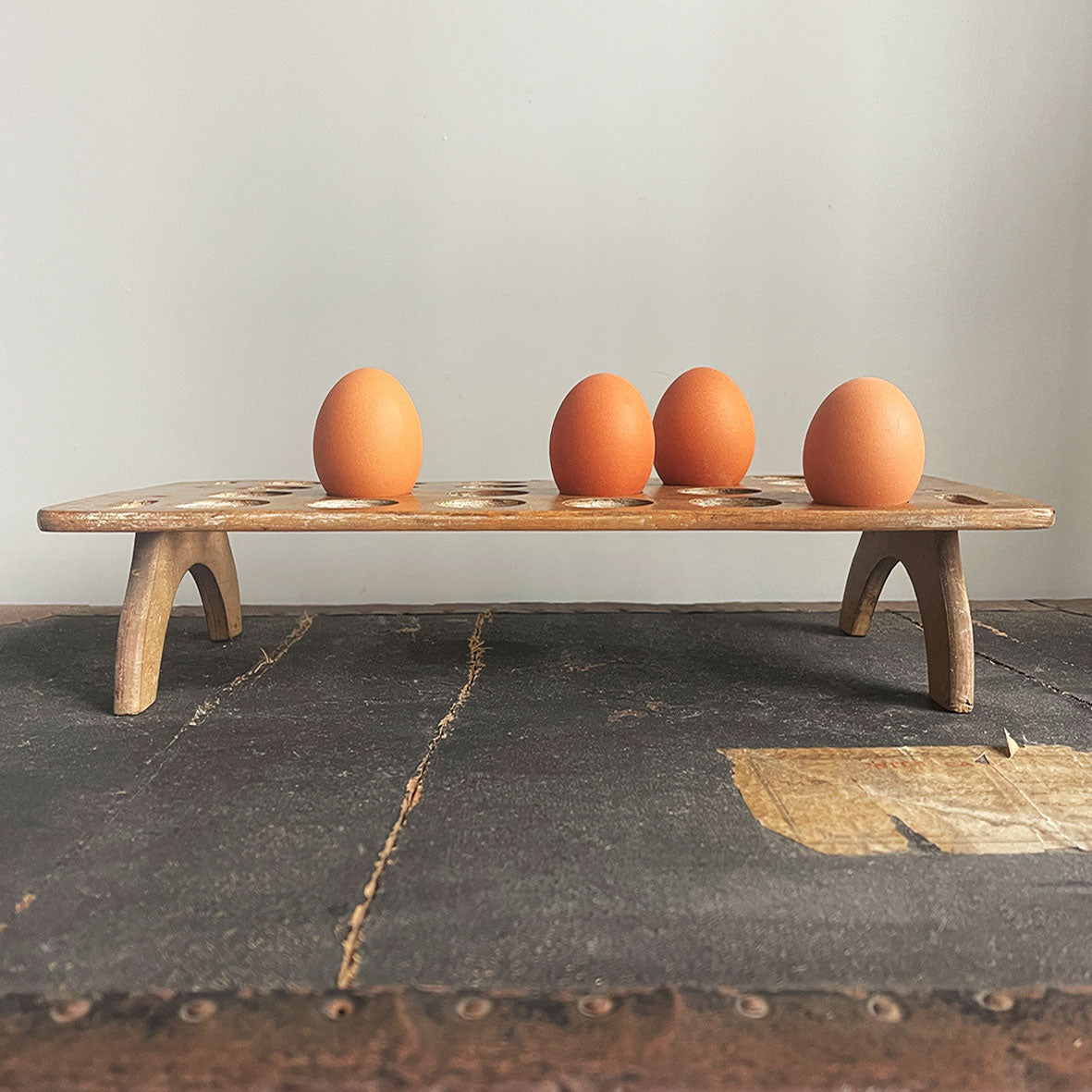 A late Victorian/Edwardian treen egg rack, dating from the late 1800s to early 1900s which can hold up to 24 eggs on a single tier. Simple in construction and in a primitive and rustic style - SHOP NOW - www.intovintage.co.uk