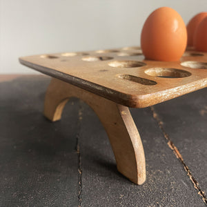 A late Victorian/Edwardian treen egg rack, dating from the late 1800s to early 1900s which can hold up to 24 eggs on a single tier. Simple in construction and in a primitive and rustic style - SHOP NOW - www.intovintage.co.uk