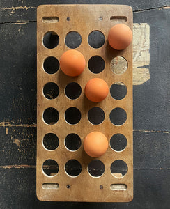 A late Victorian/Edwardian treen egg rack, dating from the late 1800s to early 1900s which can hold up to 24 eggs on a single tier. Simple in construction and in a primitive and rustic style - SHOP NOW - www.intovintage.co.uk