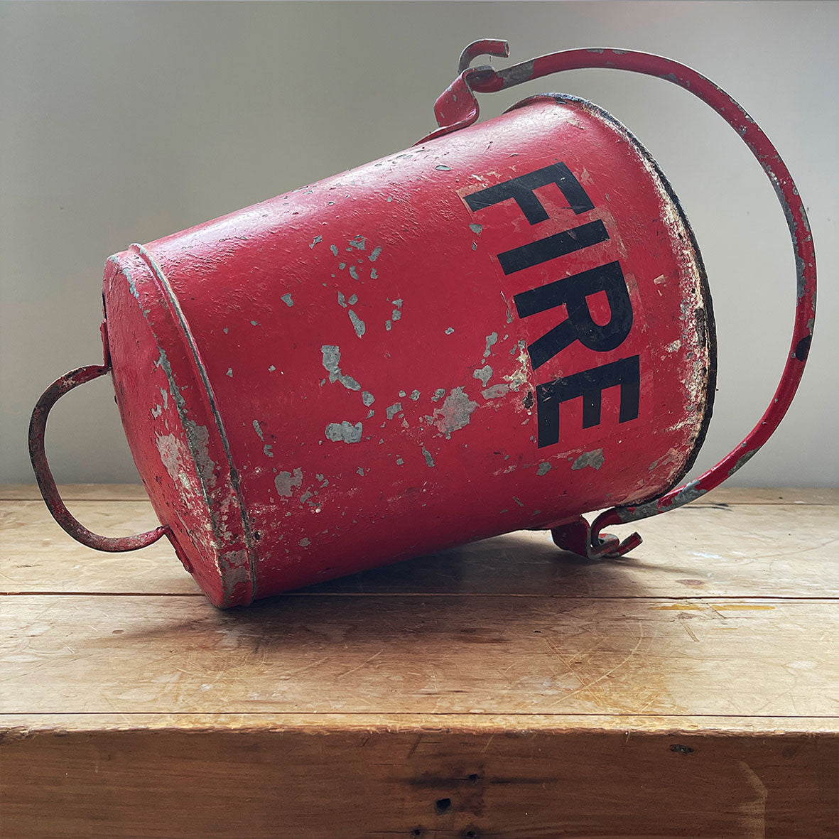 Vintage galvanised steel fire bucket with a wonderful distressed patina to it's red surface - SHOP NOW - www.intovintage.co.uk