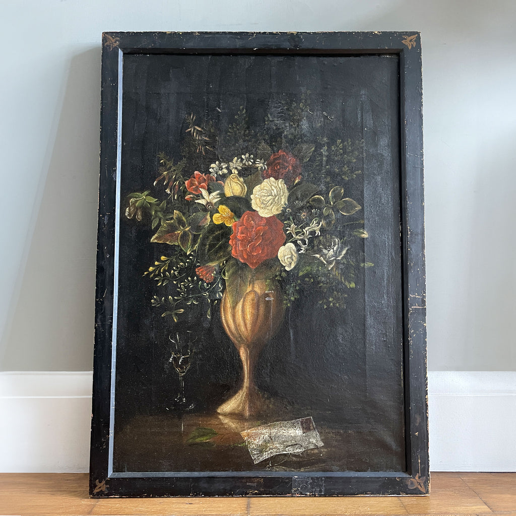 A rather beautiful oil painting in the Manner of Jean Baptiste Monnoyer of a rich flowery bouquet in a golden vase. The flowers are well defined against a dark background. An envelope and wine glass sit to the front and side of the vase. Presented in a distressed black and gold frame - SHOP NOW - www.intovintage.co.uk