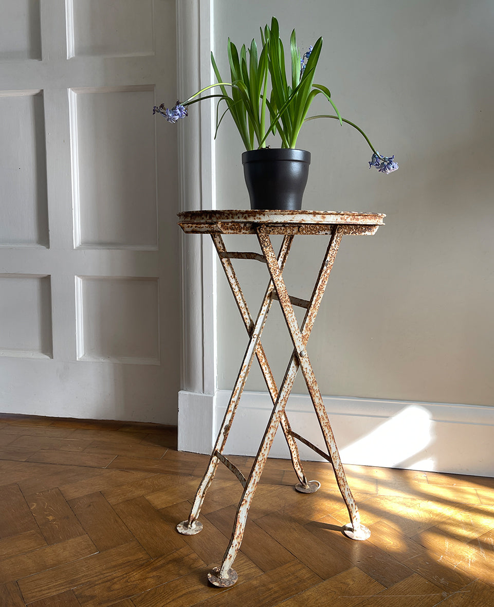 A demure Vintage French Folding Garden Table with perfect weathering to the paintwork. Perfect for all your outdoor needs, and ideal for a balcony. This table seamlessly combines style and functionality with its unique folding design - SHOP NOW - www.intovintage.co.uk