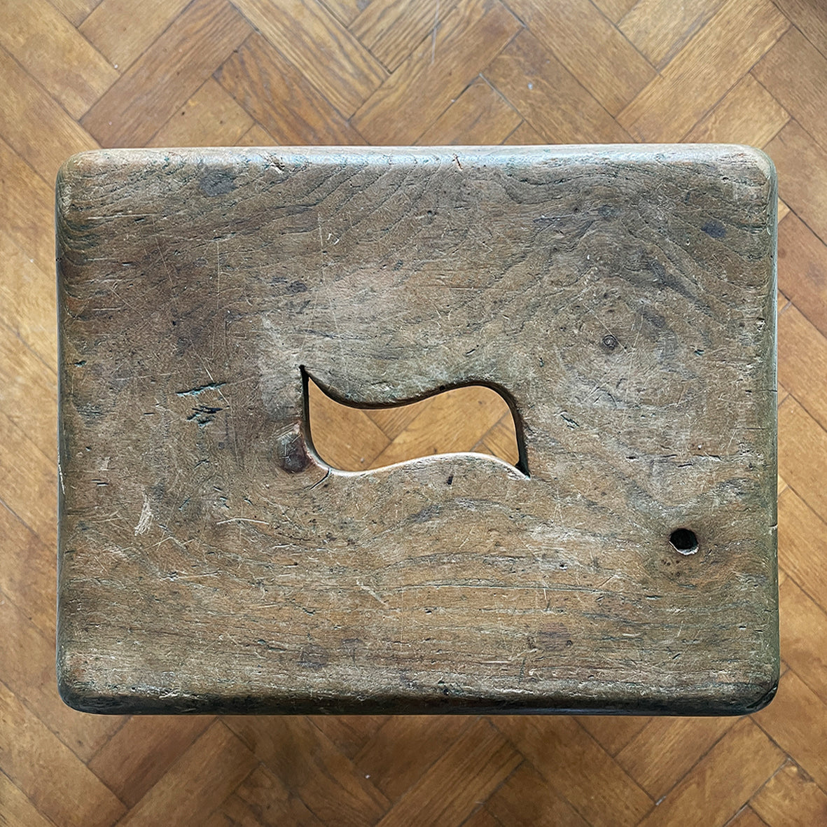 A vintage George VI stamped stool. Fantastic age related wear and patina yet still totally solid. The seat section has a cut in 'S' shaped handle - SHOP NOW - www.intovintage.co.uk