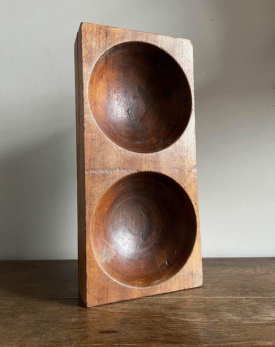 A 1930s Antique Money. Made of solid Mahogany, it has 2 deep bored bowls where money would have been kept. These trays were made to be used by shop keeps and market traders in the late 19th and early 20th century - SHOP NOW - www.intovintage.co.uk