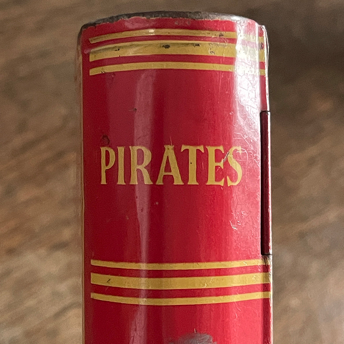 A Vintage 1950s Chad Valley Pirate Tin-Plate Money Box that looks like a book. With a cracking pirate image to the front and the word 'PIRATES' on the spine - SHOP NOW - www.intoVintage.co.uk