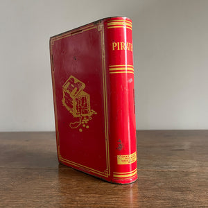 A Vintage 1950s Chad Valley Pirate Tin-Plate Money Box that looks like a book. With a cracking pirate image to the front and the word 'PIRATES' on the spine - SHOP NOW - www.intoVintage.co.uk