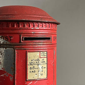 An charming early 20th Century Post Box Tin with lid. It has a slot for your pennies and a handy alphabet on the reverse edged with coins and stamps - SHOP NOW - www.intovintage.co.uk