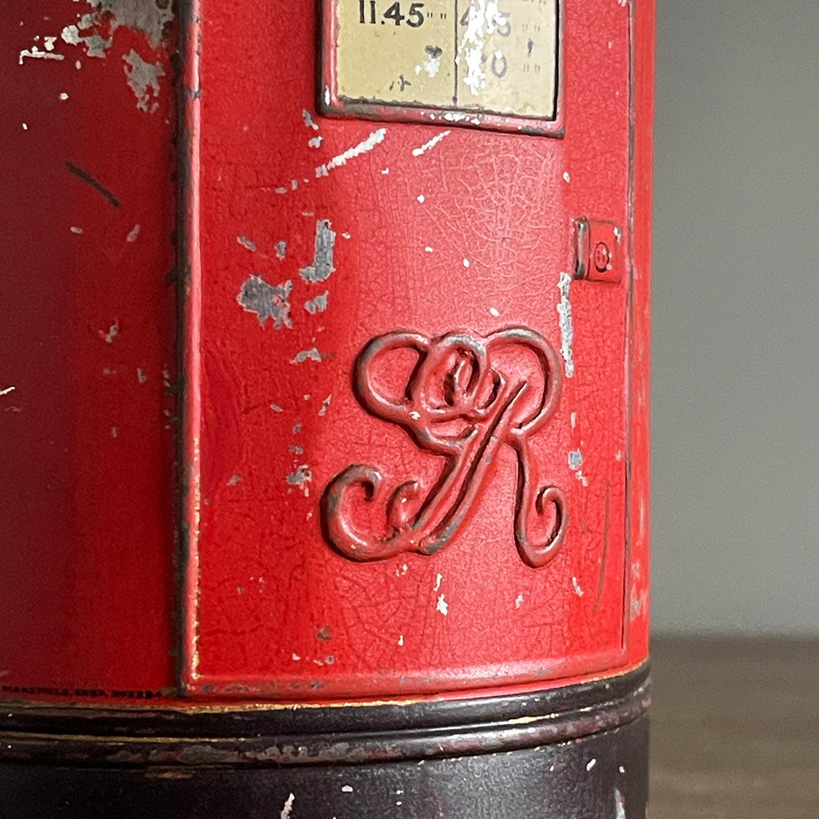 An charming early 20th Century Post Box Tin with lid. It has a slot for your pennies and a handy alphabet on the reverse edged with coins and stamps - SHOP NOW - www.intovintage.co.uk