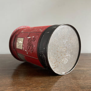 An charming early 20th Century Post Box Tin with lid. It has a slot for your pennies and a handy alphabet on the reverse edged with coins and stamps - SHOP NOW - www.intovintage.co.uk