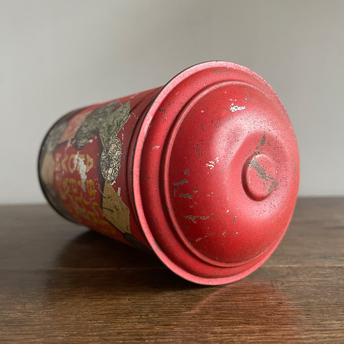 An charming early 20th Century Post Box Tin with lid. It has a slot for your pennies and a handy alphabet on the reverse edged with coins and stamps - SHOP NOW - www.intovintage.co.uk