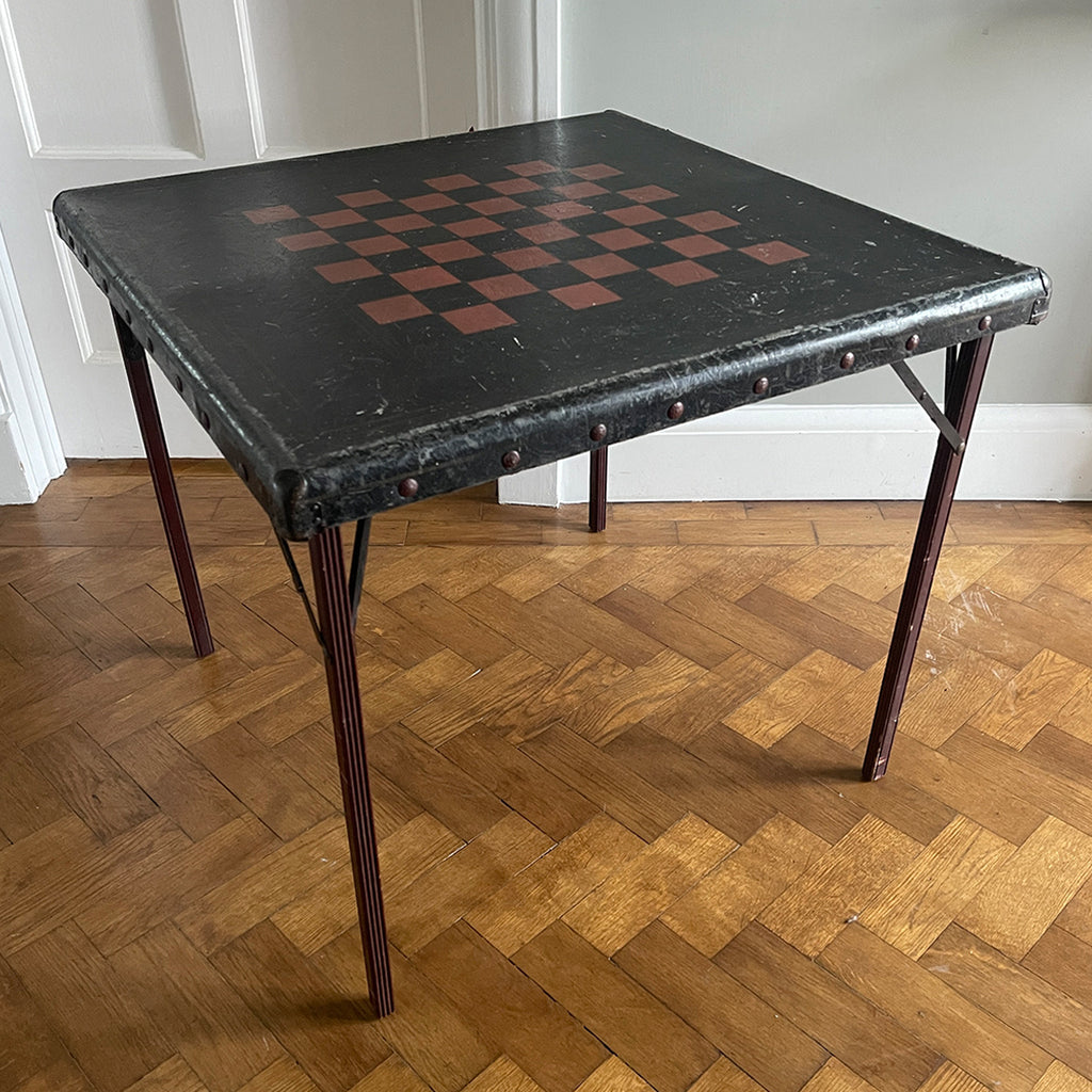 A Samson Folding Chess Table by Schwayder Brothers of Detroit. With a studded edge, metal corners and sturdy folding legs. It has a great aged look to it with original sales sticker underneath showing five gents standing on the table to showcase its strength, hence the name 'Samson'! SHOP NOW - www.intovintage.co.uk