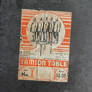 A Samson Folding Chess Table by Schwayder Brothers of Detroit. With a studded edge, metal corners and sturdy folding legs. It has a great aged look to it with original sales sticker underneath showing five gents standing on the table to showcase its strength, hence the name 'Samson'! SHOP NOW - www.intovintage.co.uk