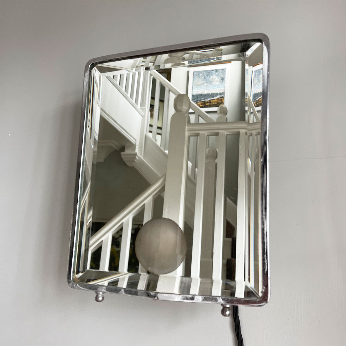 A stylish Art Deco Vanity Mirror that is lit from behind that creates a gorgeous soft defused light. The frame is nickel plated and has an electrical bulb fitting which has been re-wired with black vintage look cord flex - SHOP NOW - www.intovintage.co.uk