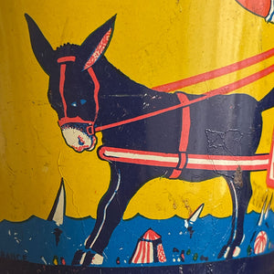 A Vintage Child's Tin Beach Bucket in sunny bright colours. The delightful scene on the side shows a donkey pulling along a lad giving a lift to a young lady with her parasol. These tin buckets are becoming increasingly rare and are very collectable - SHOP NOW - www.intovintage.co.uk