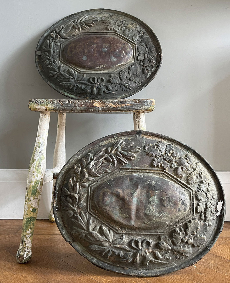 A pair of French pressed bass door plaques that came off of an old lawyer's office. Oak and olive leaves surround a central panel that has some very faded type. Great age and wear to their surfaces - SHOP NOW - www.intovintage.co.uk