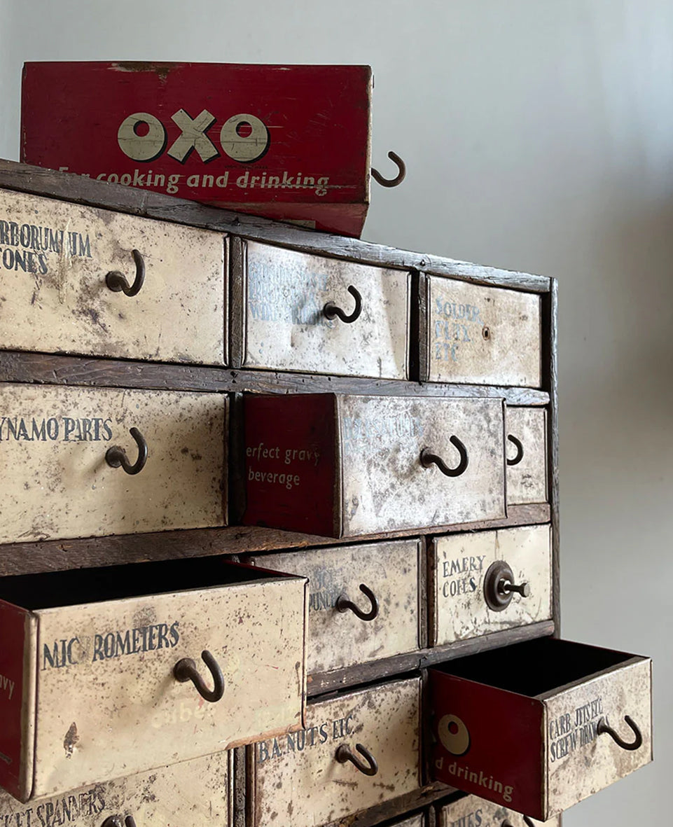 A wonderful set of mechanics scratch-built work drawers with a secret... every single drawer is made from an old OXO tin and the maker who created the piece has carefully hand painted serif titles on each of the drawers fronts - SHOP NOW - www.intovintage.co.uk