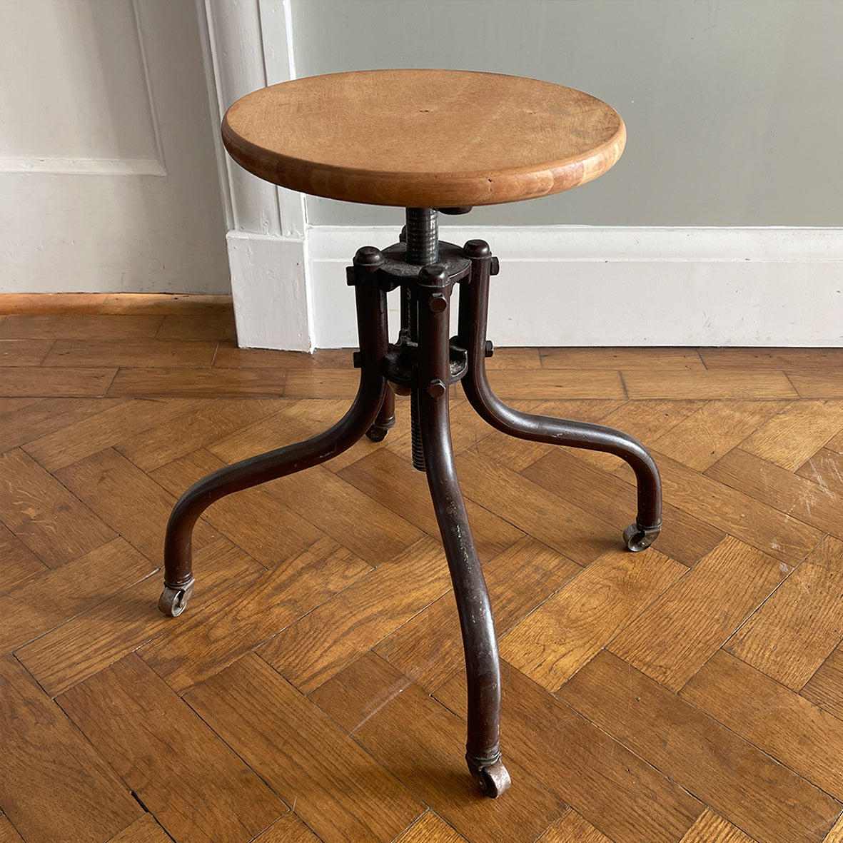 A Vintage Metal and Wood Stool set on dolly 4 wheels with an adjustable seat that when rotated adjusts the height of the seat.&nbsp; - SHOP NOW - www.intovintage.co.uk