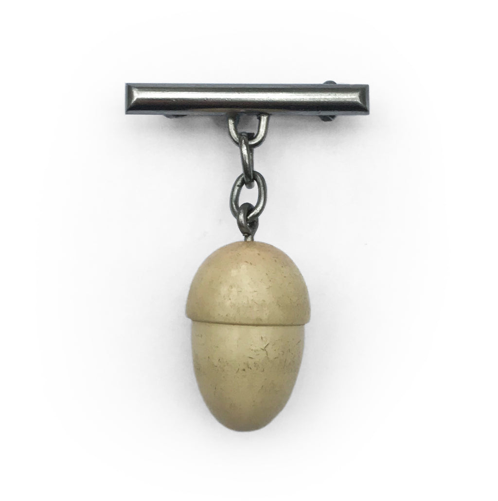 Vintage acorn pin brooch that hangs from a white metal bar and chain - SHOP NOW - www.intovintage.co.uk