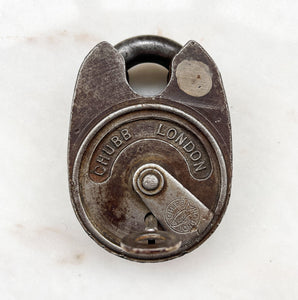 A large chunky vintage Chubb Padlock with a wonderful patina to its surface. Marked 'CHUBB LONDON' with the Chubb fish emblem on the key hole cover. Stamped '669' to the rear. Very solid with a satisfying clunk when locked. Fully working with key.  - SHOP NOW - www.intovintage.co.uk