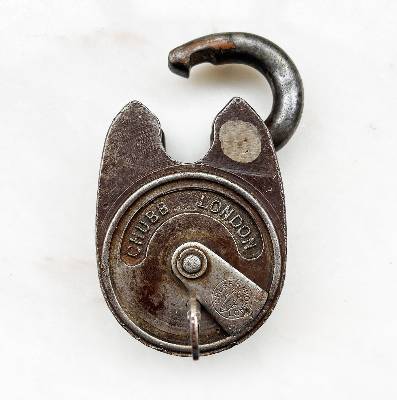 A large chunky vintage Chubb Padlock with a wonderful patina to its surface. Marked 'CHUBB LONDON' with the Chubb fish emblem on the key hole cover. Stamped '669' to the rear. Very solid with a satisfying clunk when locked. Fully working with key.  - SHOP NOW - www.intovintage.co.uk