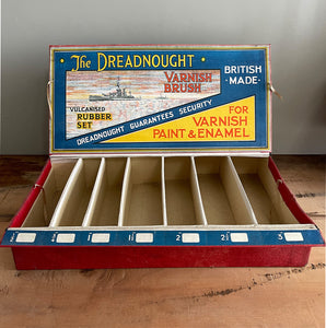 An Edwardian Dreadnaught Varnish Brush Shop Display. This would have sat on a hardware counter displaying vulcanised rubber brushes that varied in size. What makes it even more fantastic is the illustration of the famous British HMS Dreadnought battleship, Great original colour to the inside - SHOP NOW - www.intovintage.co.uk