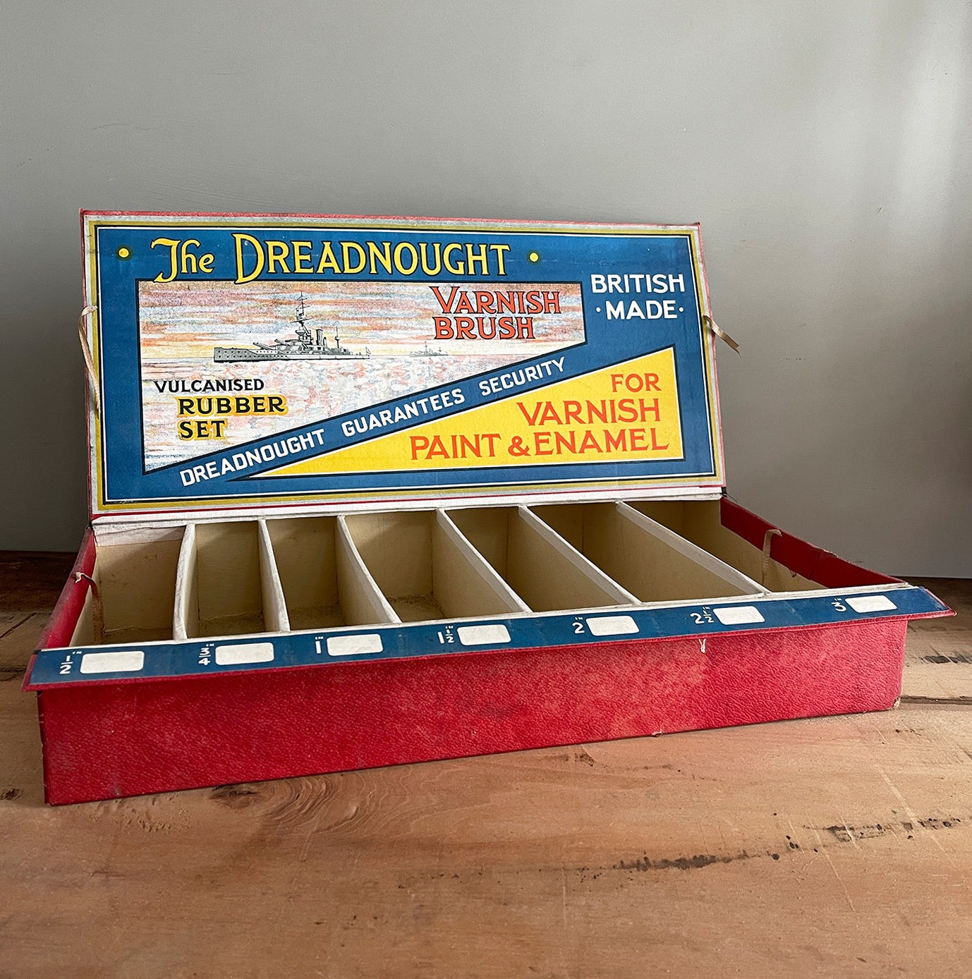 An Edwardian Dreadnaught Varnish Brush Shop Display. This would have sat on a hardware counter displaying vulcanised rubber brushes that varied in size. What makes it even more fantastic is the illustration of the famous British HMS Dreadnought battleship, Great original colour to the inside - SHOP NOW - www.intovintage.co.uk