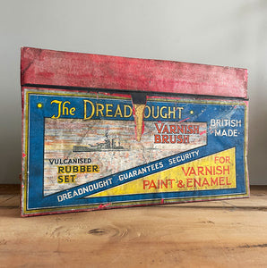 An Edwardian Dreadnaught Varnish Brush Shop Display. This would have sat on a hardware counter displaying vulcanised rubber brushes that varied in size. What makes it even more fantastic is the illustration of the famous British HMS Dreadnought battleship, Great original colour to the inside - SHOP NOW - www.intovintage.co.uk