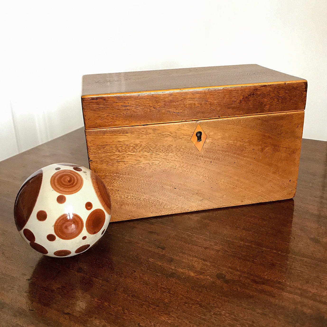 Nice sized Georgian Mahogany and Blonde Wood Tea Caddy. Mahogany carcass, edge lined in a blond wood on the lid, escutcheon and inside edge. Two lids sit atop the two inner compartments. The inner lid has its original red paper lining - SHOP NOW - www.intovintage.co.uk