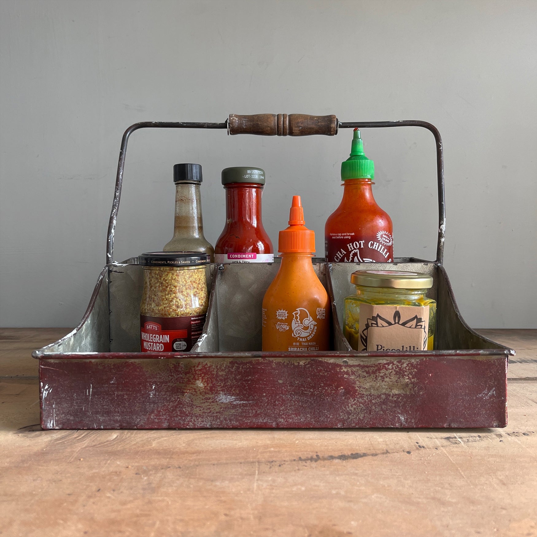 A practical Industrial Trug in an attractive time worn burgundy finish. The tray has four handy compartments ideal for keeping your condiments tidy on the dining table. Good looking and useful too - SHOP NOW - www.intovintage.co.uk