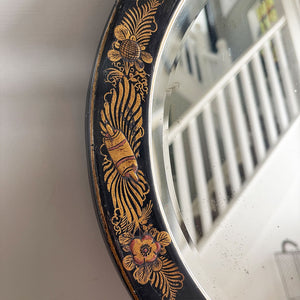 An Antique quality decorated black lacquer oval wall mirror. The original mirrored glass is beveled, has good foxing and is in good condition - SHOP NOW - www.intovintage.co.uk