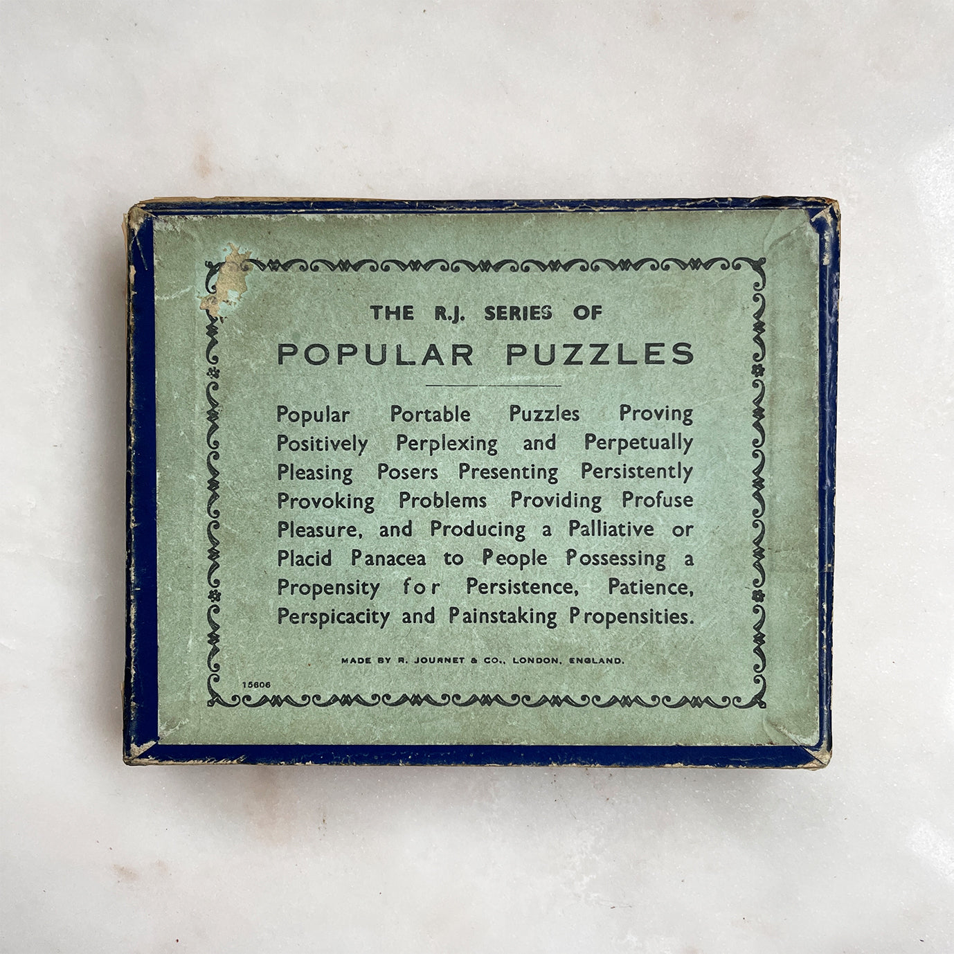 A Vintage Juggle Puzzle by R.Journet & Co. Can you Juggle the red beans in to the red bottles and the black beans into the black? - SHOP NOW - www.intovintage.co.uk