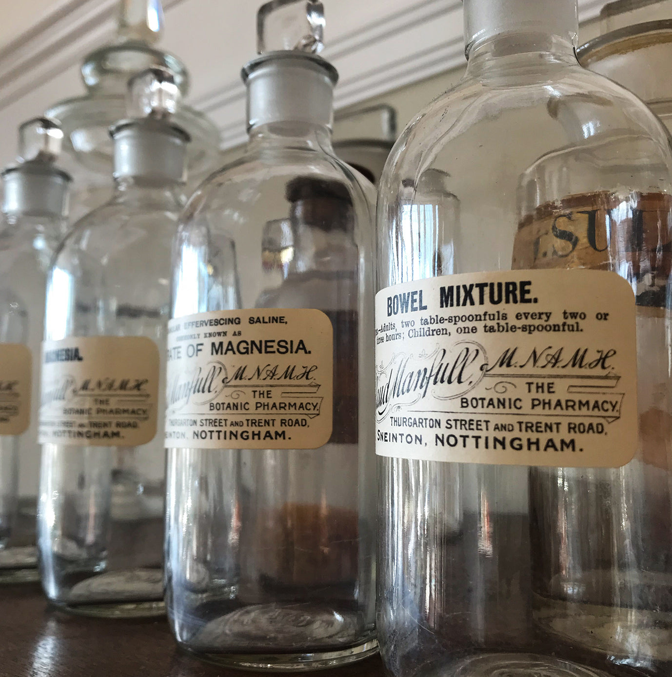 Set of Six Clear Apothecary Bottles with original paper labels from The Botanic Pharmacy, Thurgarton Street and Trent Road, Nottingham - SHOP NOW - www.intovintage.co.uk