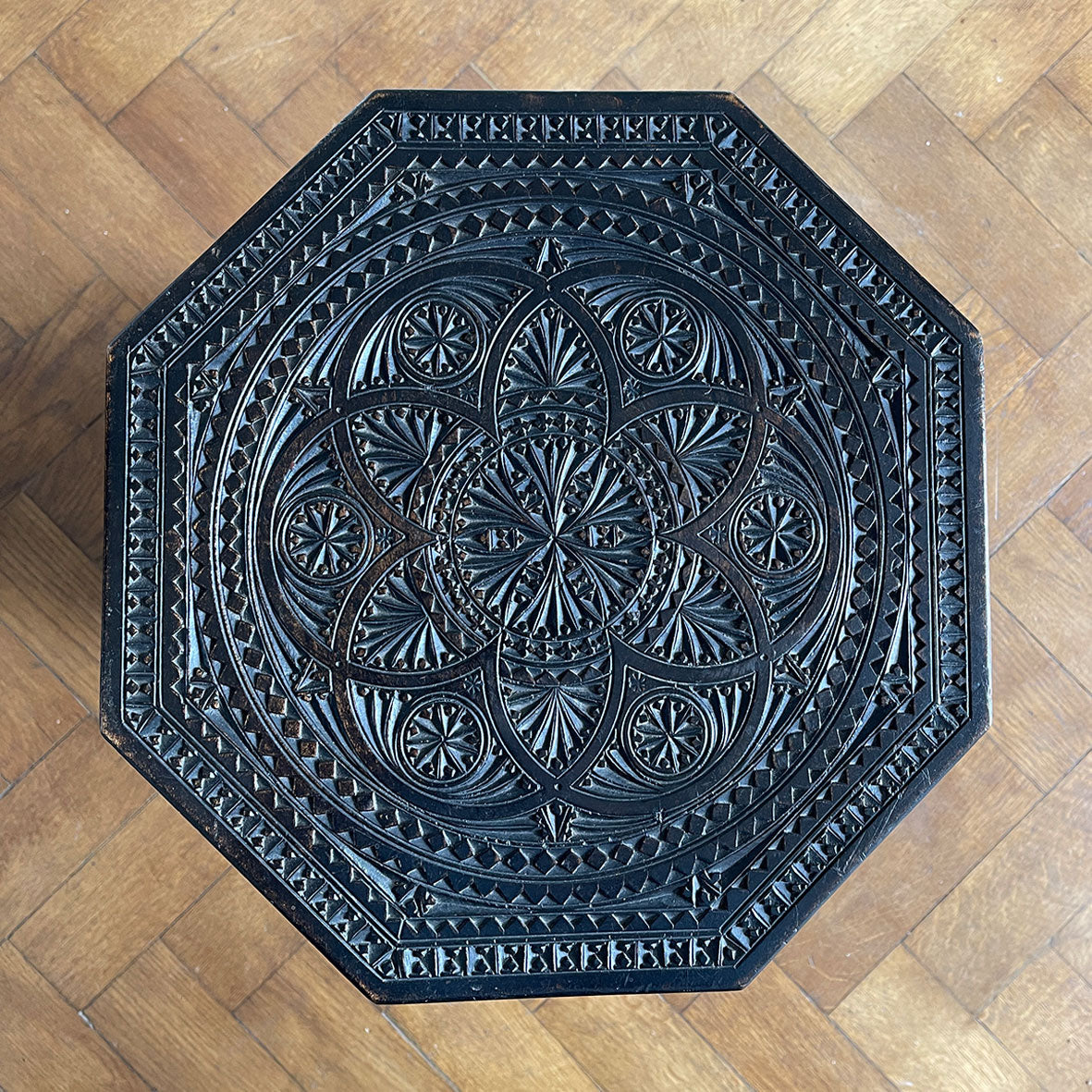 A Carved Ebonised Occasional Table. It has an octagonal top and is covered in beautiful decorative carving - SHOP NOW - www.intovintage.co.uk