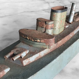In rust we trust... Stylish old wood and lithographed tin plate battle ship with a great patina. Four gun turrets, three funnels and bridge with tiny sailors at the helm - SHOP NOW - www.intovintage.co.uk