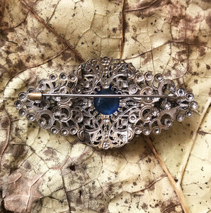 Excellent quality Edwardian Brooch with intricate design detail. Numerous faceted glass sapphires surrounding one larger blue glass gem. - SHOP NOW -  www.intovintage.co.uk