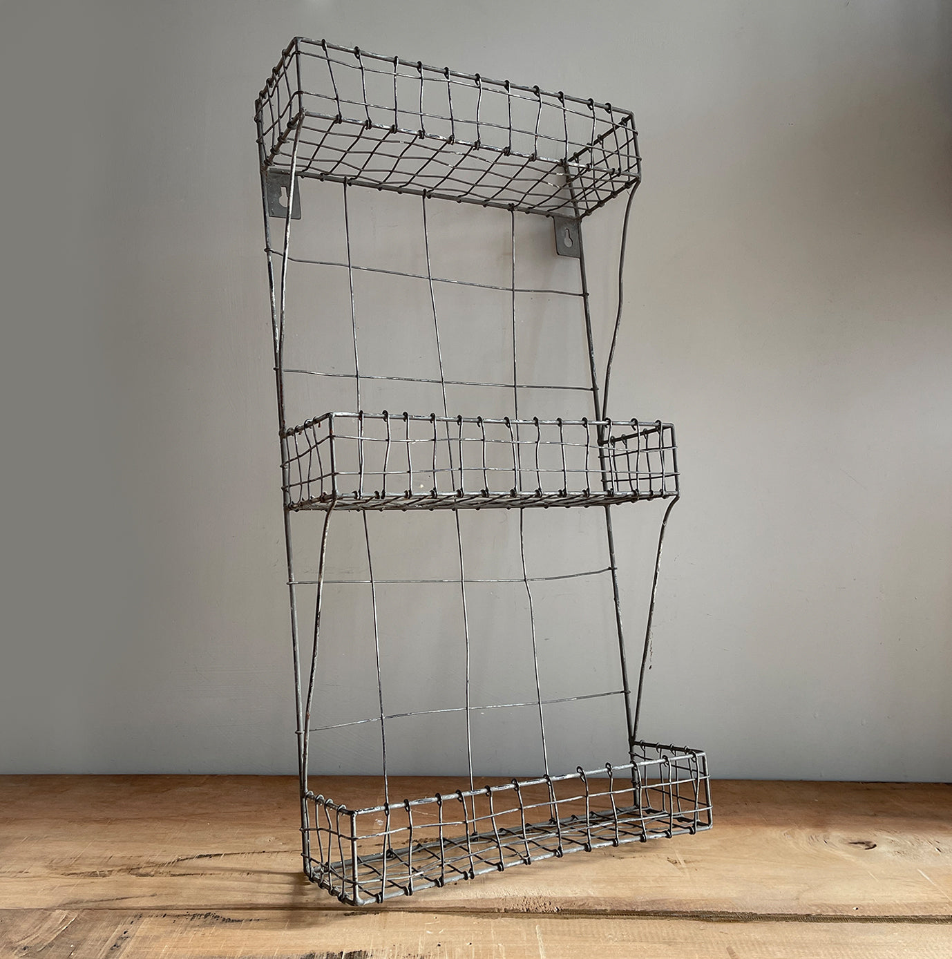 A very practical Galvanised Wire Rack. Perfect for the back of a door or even on the wall. It has eyelet fixings on the back so easy to hang - SHOP NOW - www.intovintage.co.uk